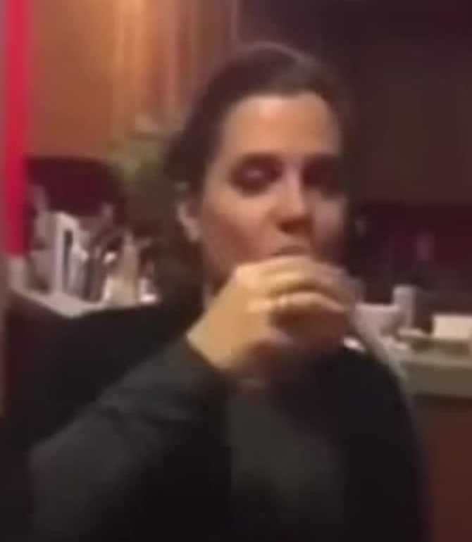 Nancy Mace downing a shot of liquor at a table in the 2016 drinking-game video