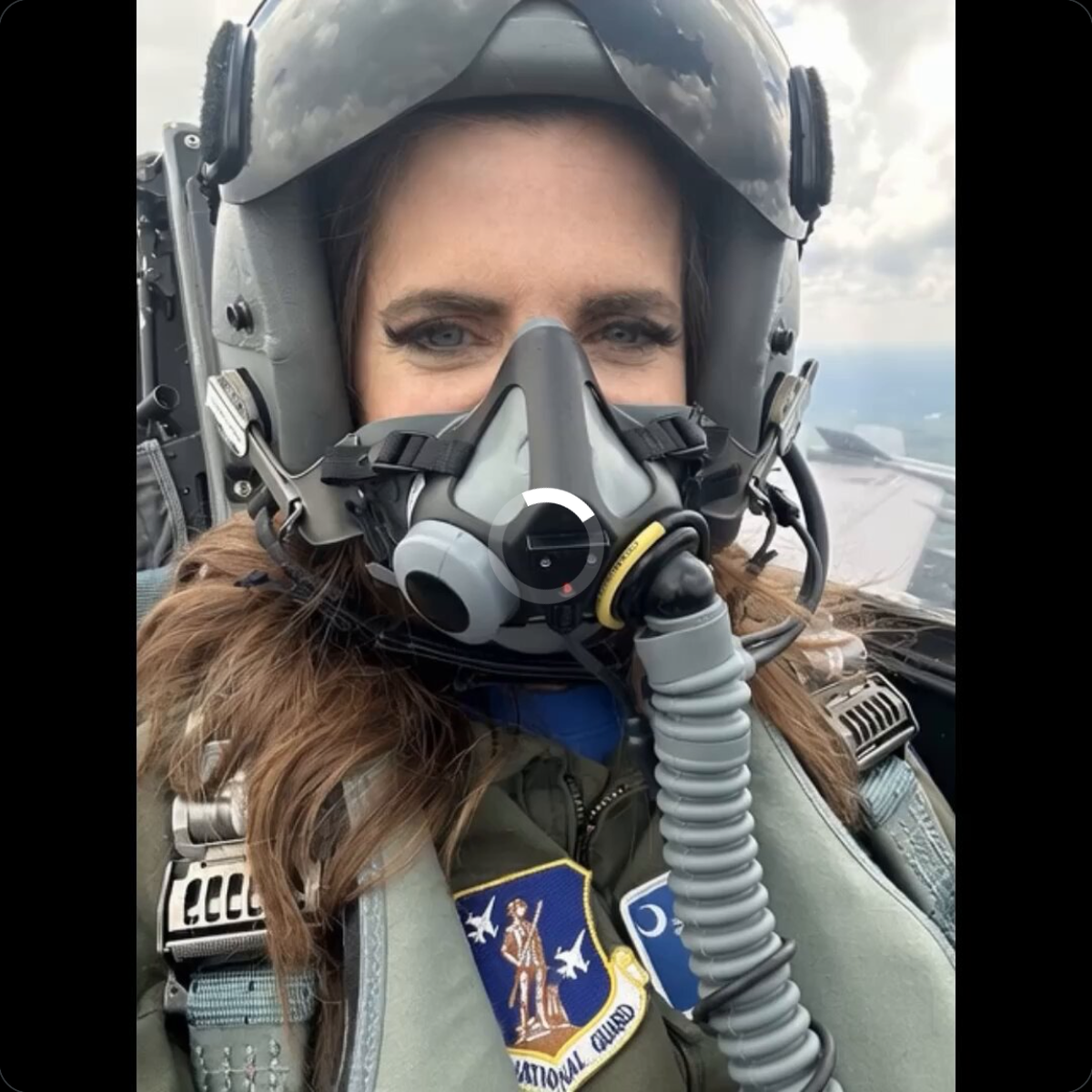 Close-up of the AI video's opening frame, Mace depicted in fighter pilot helmet and oxygen mask